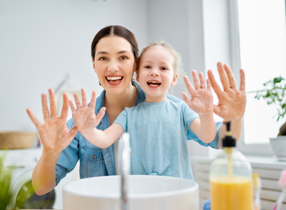 photo-a-cute-little-girl-and-her-mother-after-washing-their-hands-with-hand-soap