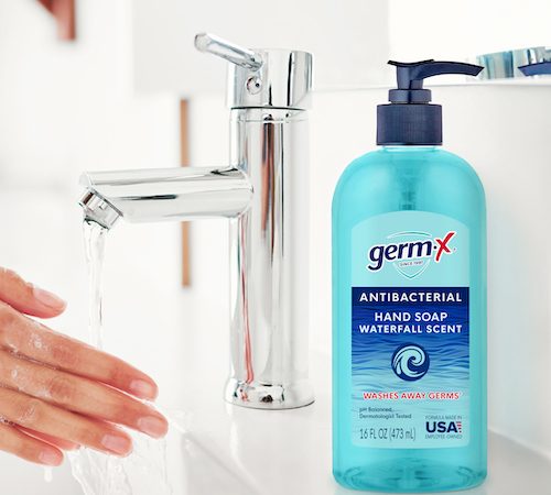 Cropped shot of a woman washing her hands in the bathroom at home