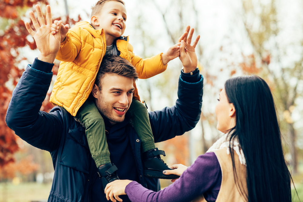 photo-young-family-have-fun-in-park-Staying-Healthy-in-Cold Weather-Blog-by-Germ-X